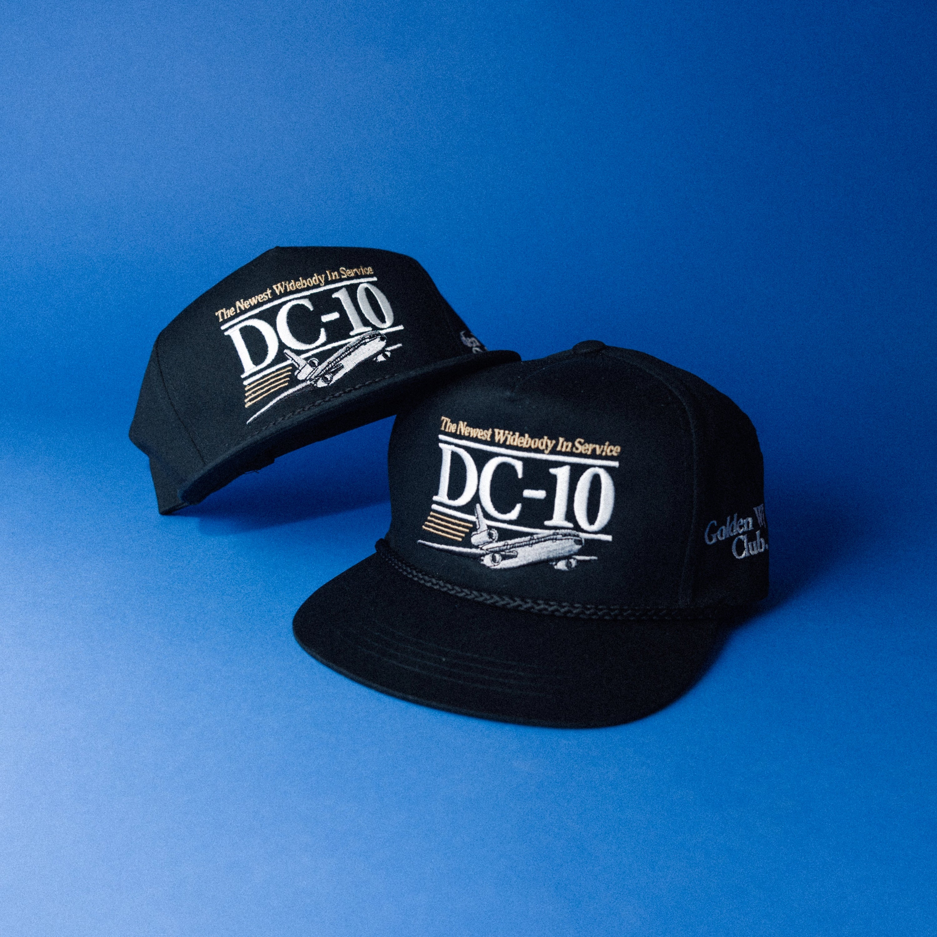 DC-10 aviation hat lifestyle shot — black braided rope cap — Golden Wing Club