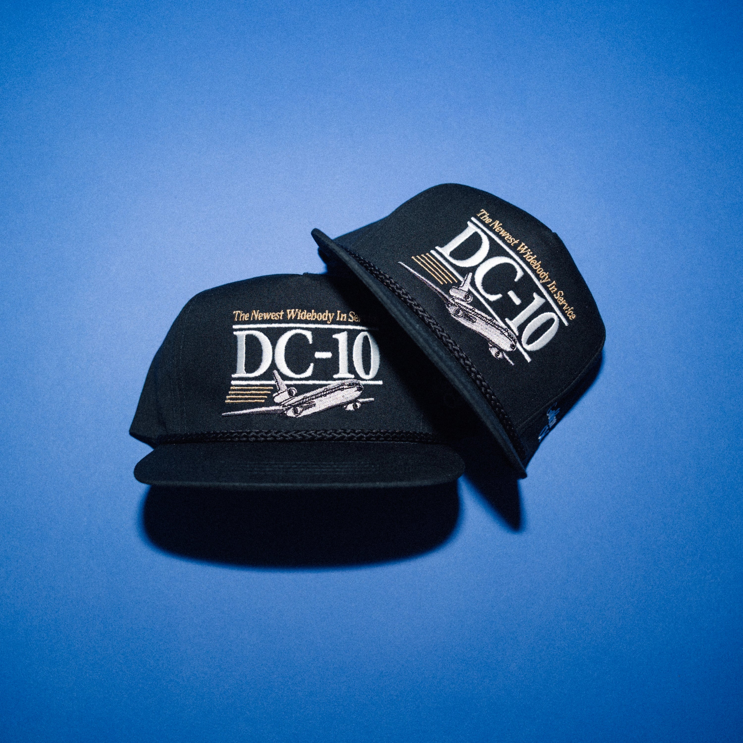 DC-10 embroidered cap detail — white and gold "The Newest Widebody In Service" — Golden Wing Club