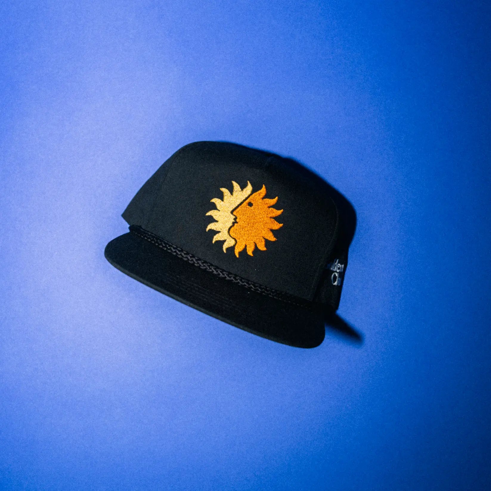 Black aviation rope hat with embroidered Sun King emblem — Golden Wing Club