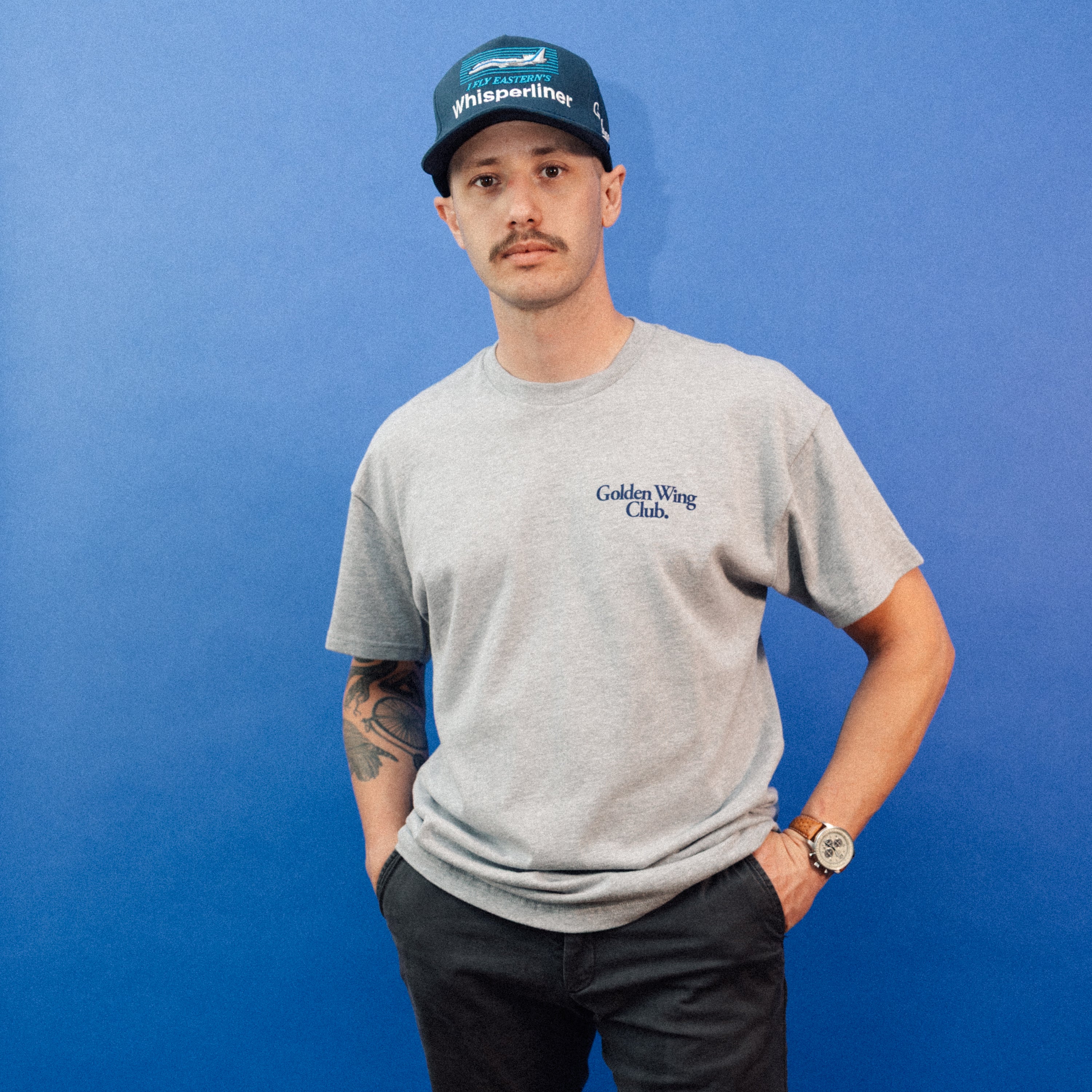 Man wearing Golden Wing Club 727 T-Shirt