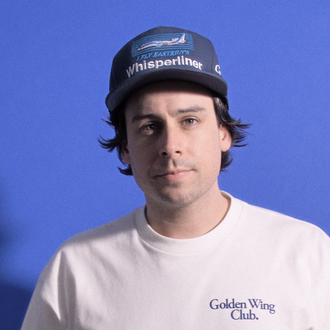 Man wearing Whisperliner Golden Wing Club Hat